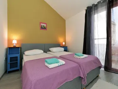 Krevet ili kreveti u jedinici u objektu Apartments Helena - Superior One bedroom apartment with Balcony and Sea View - A2