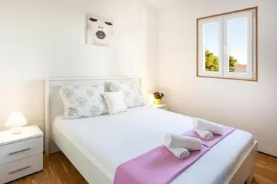Krevet ili kreveti u jedinici u objektu Apartments Apartmani Marin