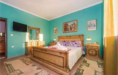 Krevet ili kreveti u jedinici u objektu Three-Bedroom Holiday Home In Trbounje
